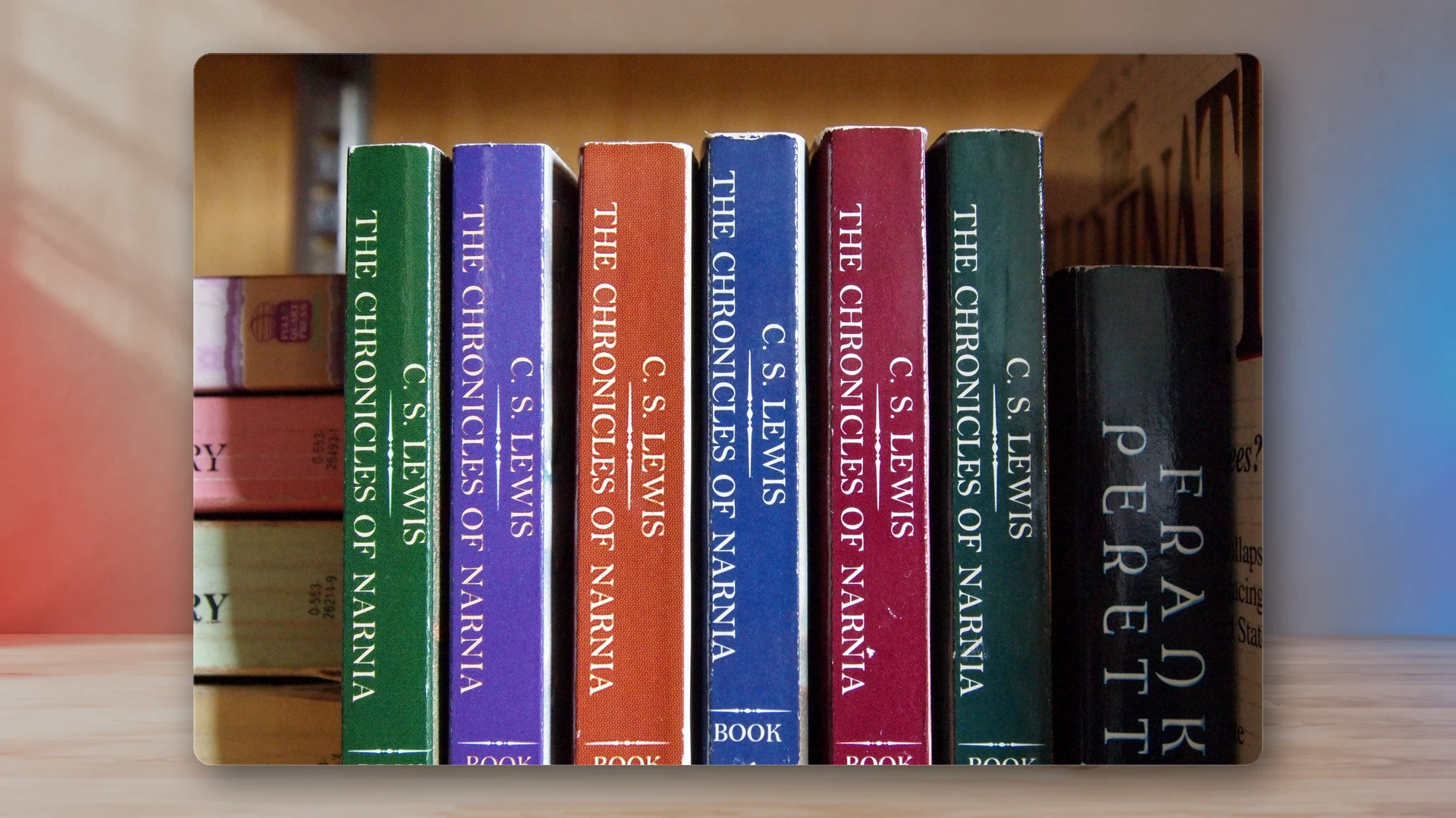 A shelf or stack of real fantasy novels suggesting an epic reading journey