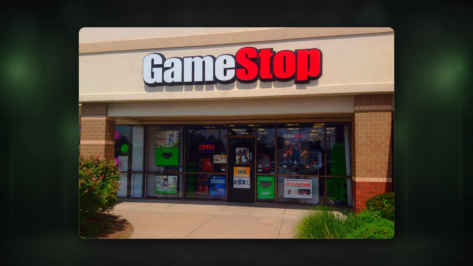 A real GameStop storefront and sign photographed from street level