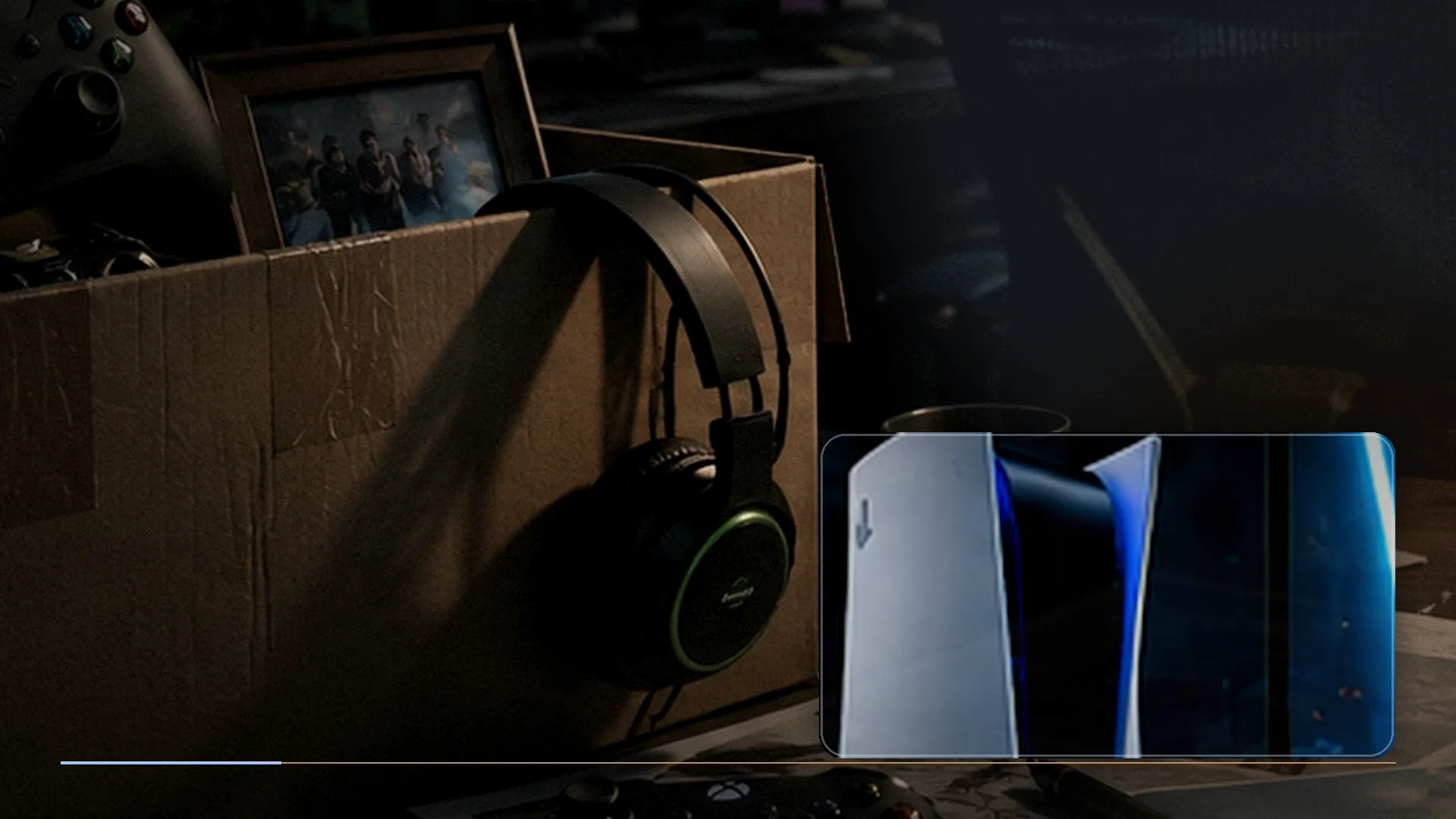 A full-size gaming headset and compact wireless earbuds arranged on a dark PlayStation setup